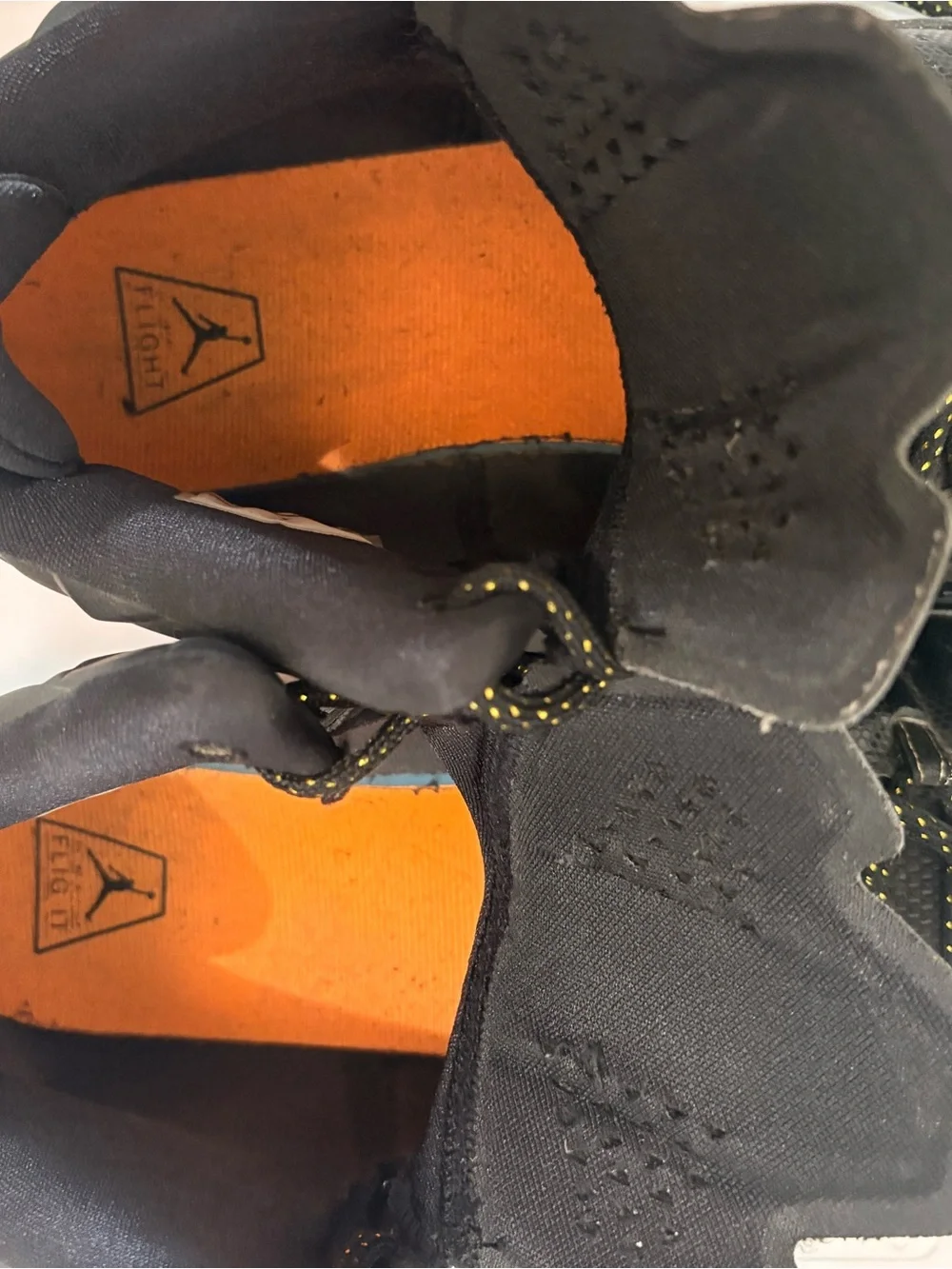 Jordan Melos Mens Black High-Top Sneakers with Orange Heel and Teal Sole